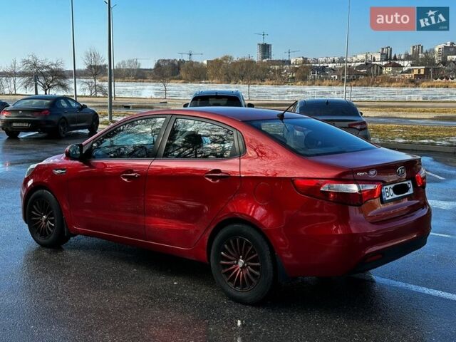 Червоний Кіа Ріо, об'ємом двигуна 1.4 л та пробігом 190 тис. км за 6350 $, фото 7 на Automoto.ua