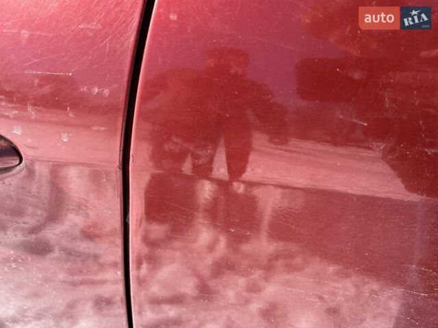 Червоний Кіа Ріо, об'ємом двигуна 1.4 л та пробігом 170 тис. км за 4500 $, фото 18 на Automoto.ua