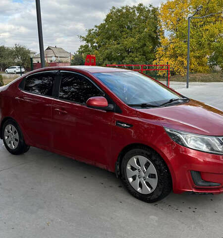 Червоний Кіа Ріо, об'ємом двигуна 1.4 л та пробігом 158 тис. км за 6500 $, фото 1 на Automoto.ua