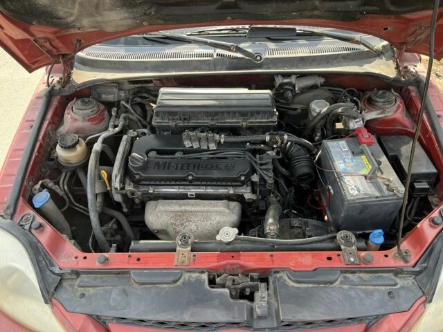 Красный Киа Рио, объемом двигателя 1.5 л и пробегом 380 тыс. км за 2150 $, фото 4 на Automoto.ua