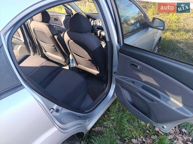 Серый Киа Рио, объемом двигателя 1.49 л и пробегом 272 тыс. км за 4500 $, фото 5 на Automoto.ua