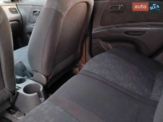 Сірий Кіа Ріо, об'ємом двигуна 1.4 л та пробігом 148 тис. км за 4950 $, фото 5 на Automoto.ua