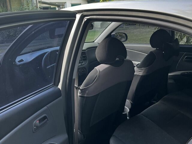 Сірий Кіа Ріо, об'ємом двигуна 1.4 л та пробігом 210 тис. км за 2999 $, фото 4 на Automoto.ua