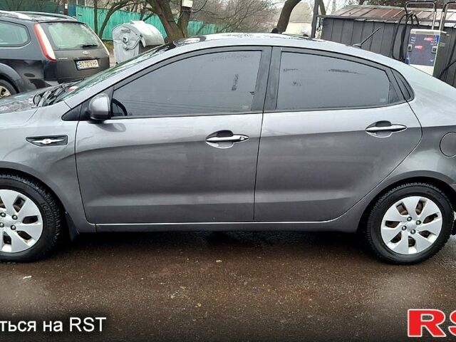 Серый Киа Рио, объемом двигателя 1.4 л и пробегом 243 тыс. км за 5700 $, фото 1 на Automoto.ua