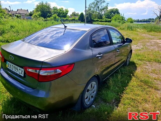 Серый Киа Рио, объемом двигателя 1.4 л и пробегом 235 тыс. км за 5600 $, фото 2 на Automoto.ua
