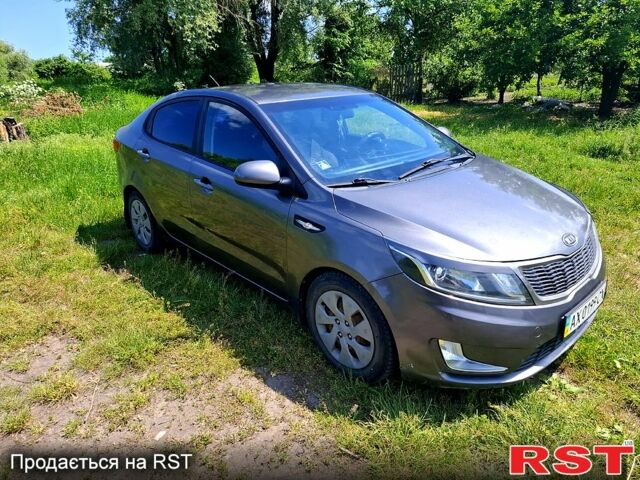 Серый Киа Рио, объемом двигателя 1.4 л и пробегом 235 тыс. км за 5600 $, фото 5 на Automoto.ua