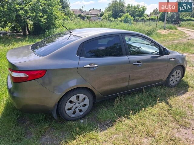 Серый Киа Рио, объемом двигателя 1.4 л и пробегом 235 тыс. км за 5600 $, фото 3 на Automoto.ua