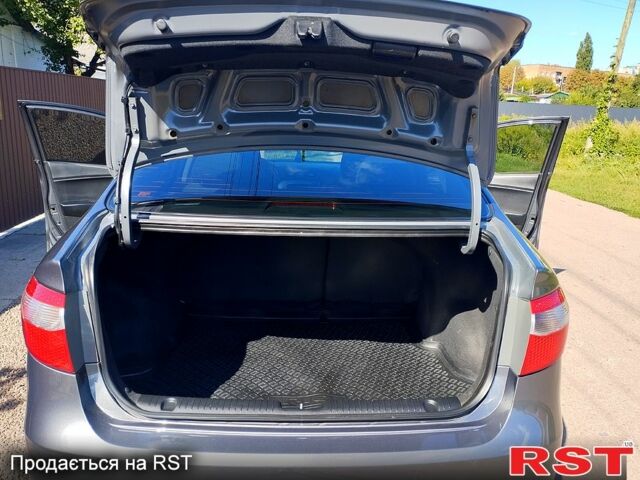 Серый Киа Рио, объемом двигателя 1.4 л и пробегом 99 тыс. км за 7100 $, фото 6 на Automoto.ua