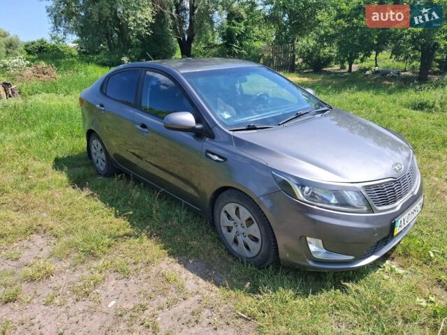 Серый Киа Рио, объемом двигателя 1.4 л и пробегом 235 тыс. км за 5600 $, фото 1 на Automoto.ua