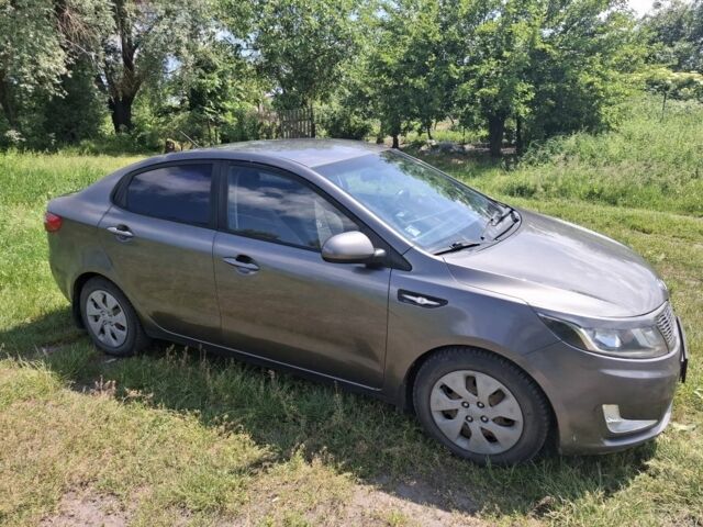 Сірий Кіа Ріо, об'ємом двигуна 1.4 л та пробігом 235 тис. км за 5800 $, фото 9 на Automoto.ua