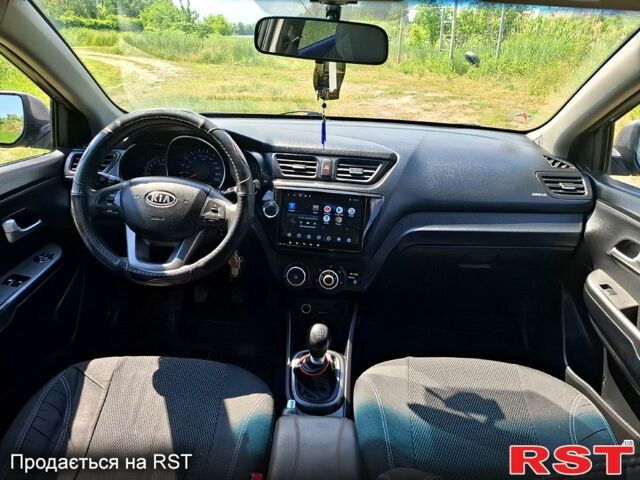Серый Киа Рио, объемом двигателя 1.4 л и пробегом 235 тыс. км за 5600 $, фото 7 на Automoto.ua