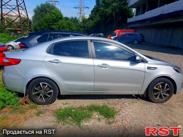 Серый Киа Рио, объемом двигателя 1.4 л и пробегом 145 тыс. км за 8210 $, фото 1 на Automoto.ua