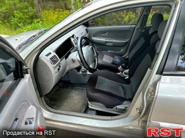 Серый Киа Рио, объемом двигателя 1.3 л и пробегом 206 тыс. км за 1750 $, фото 5 на Automoto.ua