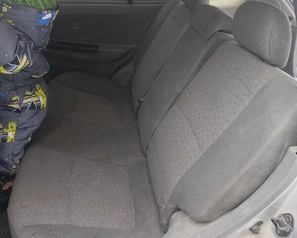 Серый Киа Рио, объемом двигателя 1.5 л и пробегом 172 тыс. км за 2200 $, фото 7 на Automoto.ua