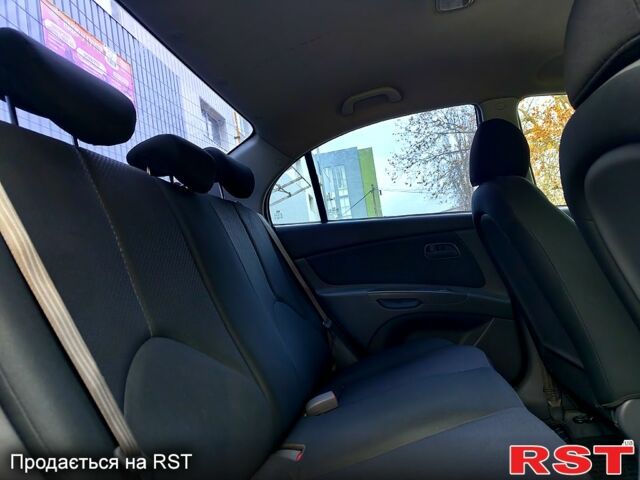 Синий Киа Рио, объемом двигателя 1.4 л и пробегом 149 тыс. км за 5800 $, фото 11 на Automoto.ua