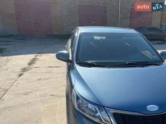 Синий Киа Рио, объемом двигателя 1.4 л и пробегом 120 тыс. км за 7499 $, фото 1 на Automoto.ua
