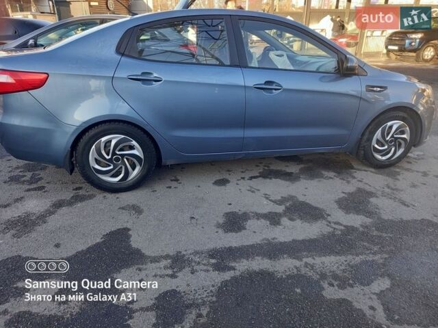 Синий Киа Рио, объемом двигателя 1.4 л и пробегом 283 тыс. км за 6600 $, фото 2 на Automoto.ua