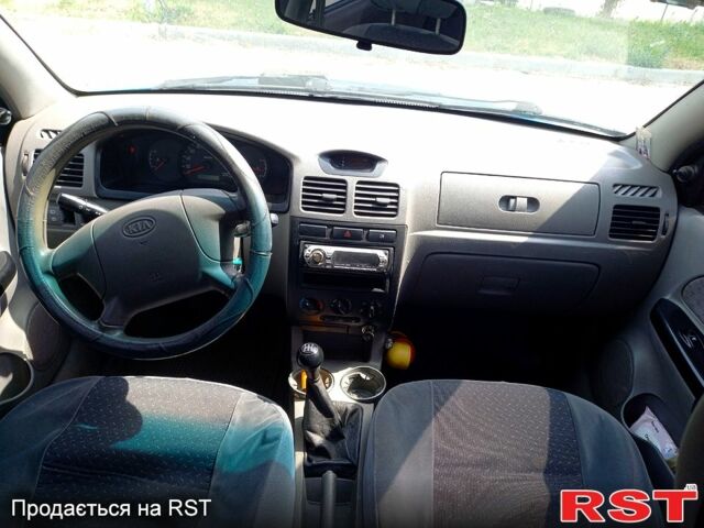 Синій Кіа Ріо, об'ємом двигуна 1.4 л та пробігом 262 тис. км за 2600 $, фото 9 на Automoto.ua