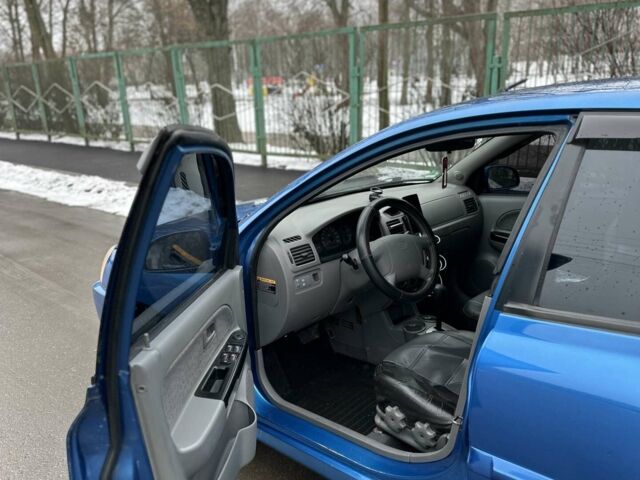 Синий Киа Рио, объемом двигателя 1.49 л и пробегом 146 тыс. км за 4800 $, фото 5 на Automoto.ua