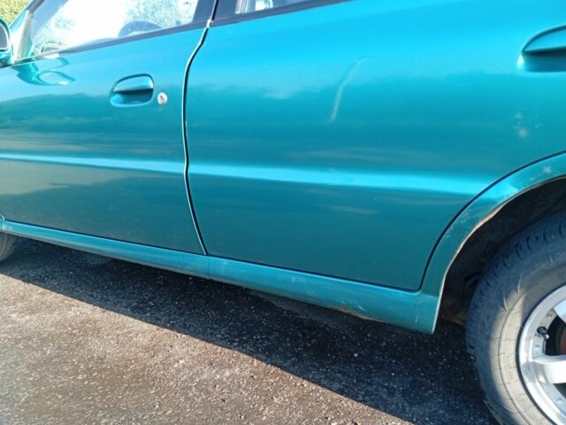 Зеленый Киа Рио, объемом двигателя 1.5 л и пробегом 270 тыс. км за 2600 $, фото 3 на Automoto.ua