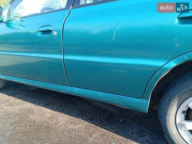 Зеленый Киа Рио, объемом двигателя 1.5 л и пробегом 270 тыс. км за 2600 $, фото 2 на Automoto.ua