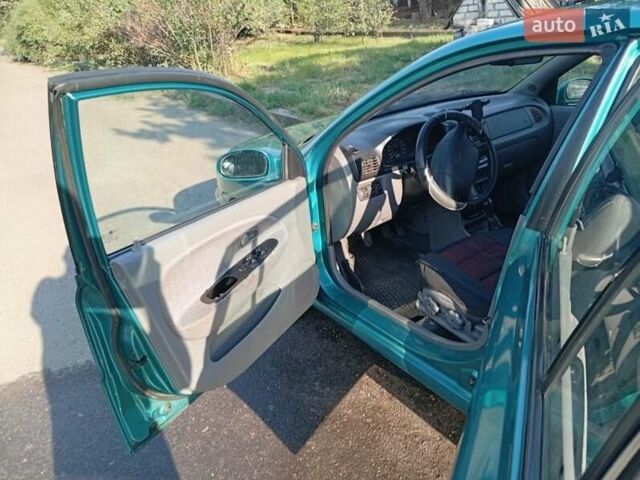 Зеленый Киа Рио, объемом двигателя 1.5 л и пробегом 270 тыс. км за 2600 $, фото 8 на Automoto.ua