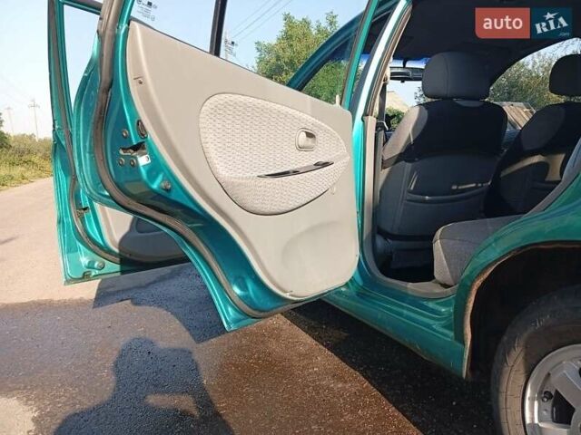 Зеленый Киа Рио, объемом двигателя 1.5 л и пробегом 270 тыс. км за 2600 $, фото 9 на Automoto.ua