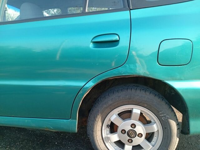 Зеленый Киа Рио, объемом двигателя 1.5 л и пробегом 270 тыс. км за 2600 $, фото 4 на Automoto.ua