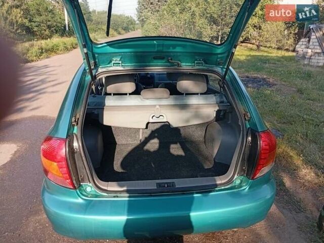 Зеленый Киа Рио, объемом двигателя 1.5 л и пробегом 270 тыс. км за 2600 $, фото 14 на Automoto.ua