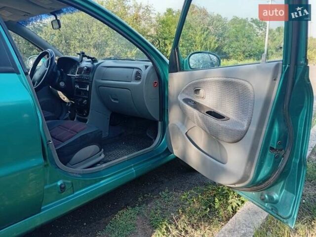 Зеленый Киа Рио, объемом двигателя 1.5 л и пробегом 270 тыс. км за 2600 $, фото 13 на Automoto.ua