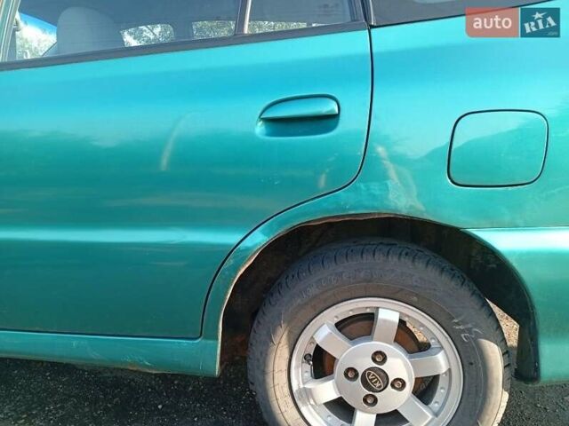 Зеленый Киа Рио, объемом двигателя 1.5 л и пробегом 270 тыс. км за 2600 $, фото 3 на Automoto.ua