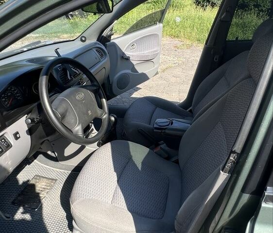 Зеленый Киа Рио, объемом двигателя 1.5 л и пробегом 128 тыс. км за 2802 $, фото 6 на Automoto.ua