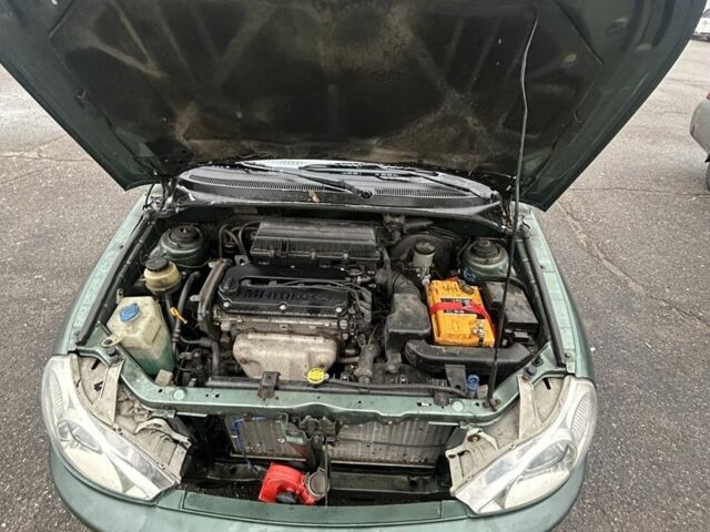 Зеленый Киа Рио, объемом двигателя 1.5 л и пробегом 235 тыс. км за 2600 $, фото 5 на Automoto.ua