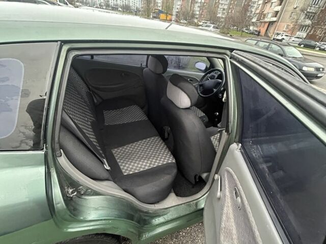 Зеленый Киа Рио, объемом двигателя 1.5 л и пробегом 235 тыс. км за 2600 $, фото 4 на Automoto.ua