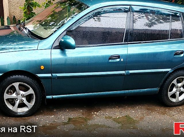 Зеленый Киа Рио, объемом двигателя 1.3 л и пробегом 554 тыс. км за 2100 $, фото 2 на Automoto.ua