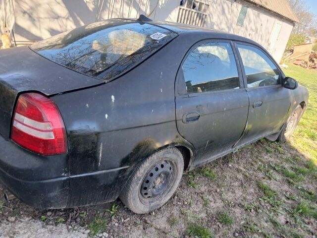 Черный Киа Сефия, объемом двигателя 1.5 л и пробегом 465 тыс. км за 900 $, фото 1 на Automoto.ua