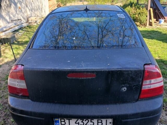 Черный Киа Сефия, объемом двигателя 1.5 л и пробегом 465 тыс. км за 900 $, фото 2 на Automoto.ua