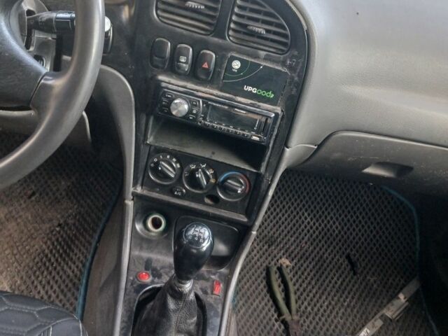 Черный Киа Сефия, объемом двигателя 1.5 л и пробегом 465 тыс. км за 900 $, фото 6 на Automoto.ua