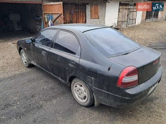 Чорний Кіа Сефія, об'ємом двигуна 1.5 л та пробігом 300 тис. км за 1200 $, фото 1 на Automoto.ua