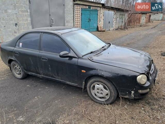 Чорний Кіа Сефія, об'ємом двигуна 1.5 л та пробігом 300 тис. км за 1200 $, фото 3 на Automoto.ua