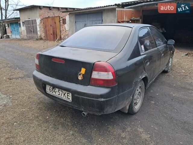 Чорний Кіа Сефія, об'ємом двигуна 1.5 л та пробігом 300 тис. км за 1200 $, фото 4 на Automoto.ua