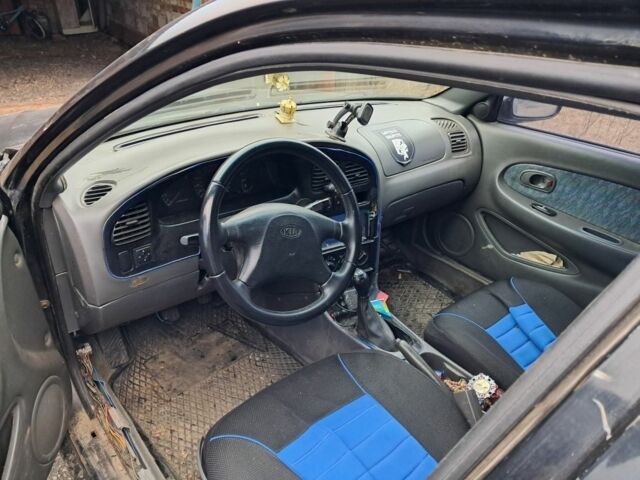 Чорний Кіа Сефія, об'ємом двигуна 1.5 л та пробігом 300 тис. км за 1308 $, фото 4 на Automoto.ua