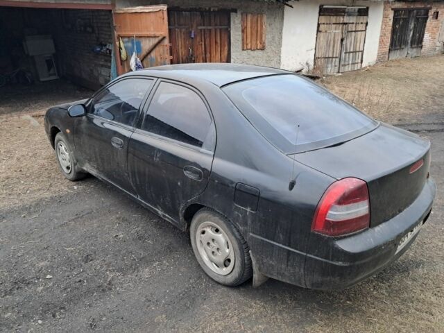 Чорний Кіа Сефія, об'ємом двигуна 1.5 л та пробігом 300 тис. км за 1308 $, фото 5 на Automoto.ua