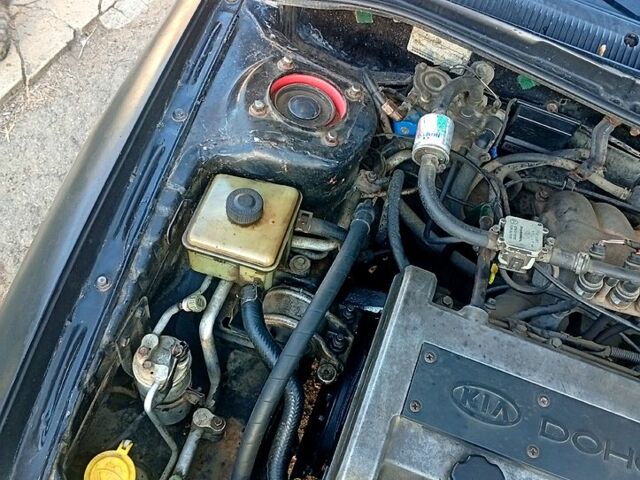 Чорний Кіа Сефія, об'ємом двигуна 1.5 л та пробігом 0 тис. км за 1550 $, фото 1 на Automoto.ua