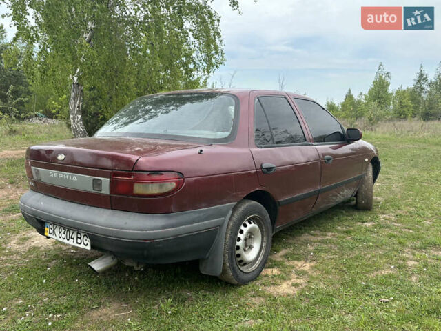 Красный Киа Сефия, объемом двигателя 1.6 л и пробегом 400 тыс. км за 1500 $, фото 4 на Automoto.ua