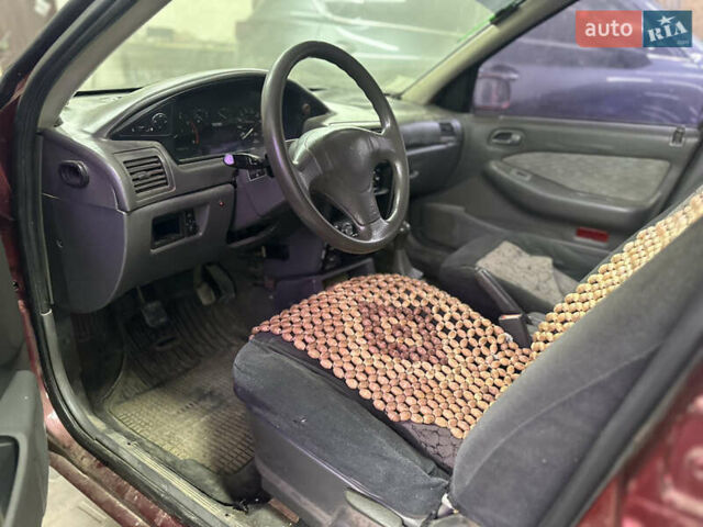 Червоний Кіа Сефія, об'ємом двигуна 1.6 л та пробігом 150 тис. км за 1000 $, фото 7 на Automoto.ua