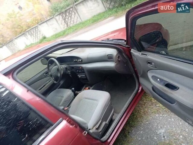 Красный Киа Сефия, объемом двигателя 1.5 л и пробегом 65 тыс. км за 1550 $, фото 2 на Automoto.ua