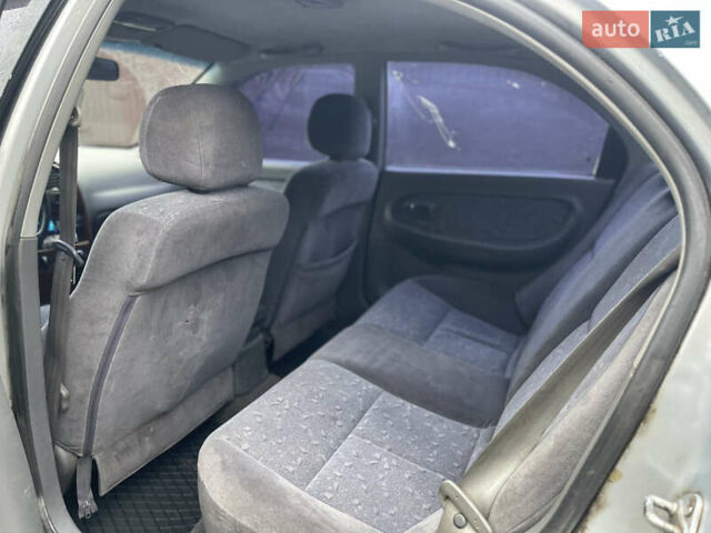 Серый Киа Сефия, объемом двигателя 1.6 л и пробегом 301 тыс. км за 1200 $, фото 10 на Automoto.ua