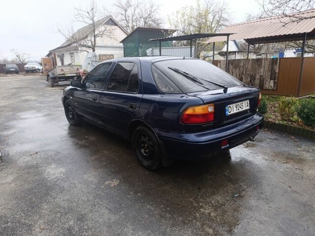 Синий Киа Сефия, объемом двигателя 1.8 л и пробегом 235 тыс. км за 1000 $, фото 3 на Automoto.ua