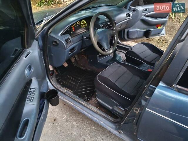Синий Киа Сефия, объемом двигателя 1.6 л и пробегом 315 тыс. км за 1350 $, фото 2 на Automoto.ua
